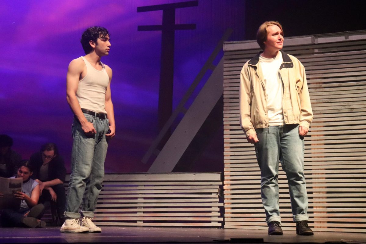 The cast of "The Outsiders" rehearses scenes from the play adaptation of the book during a dress rehearsal on Tuesday, Sept. 17, in the auditorium. 
