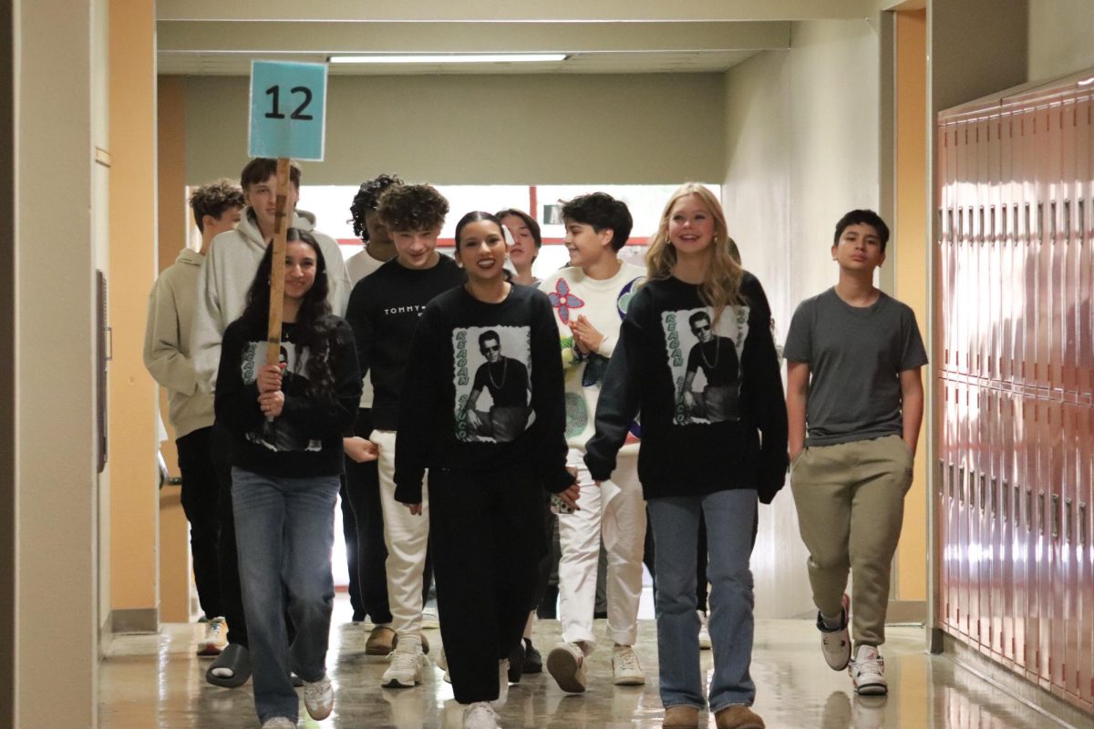 STUCO walking Lopez 8th graders through the Hawaii hallway.  