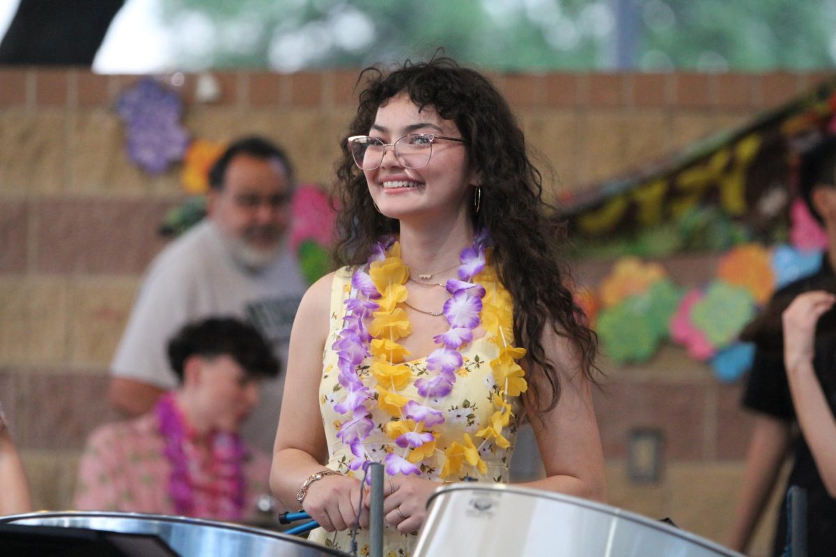 Senior Mee Mai Whitethorn smiles for the camera between songs.