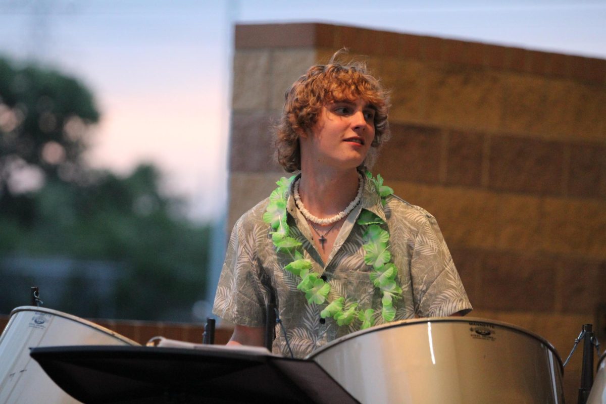 Senior Ben Williams looks at his fellow performers while playing "The Bee's Melody".