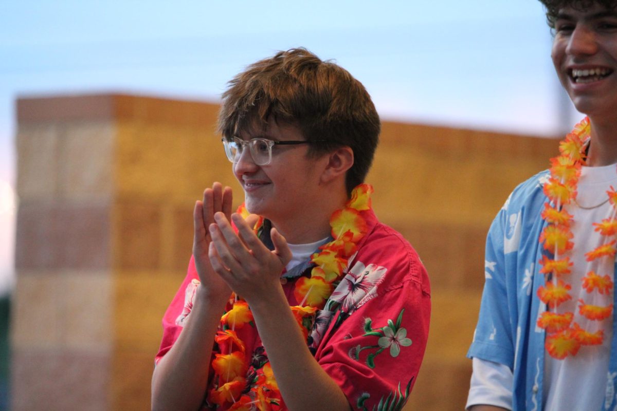 World class timpanist Aiden Vendzules claps for the celebration of his fellow seniors.