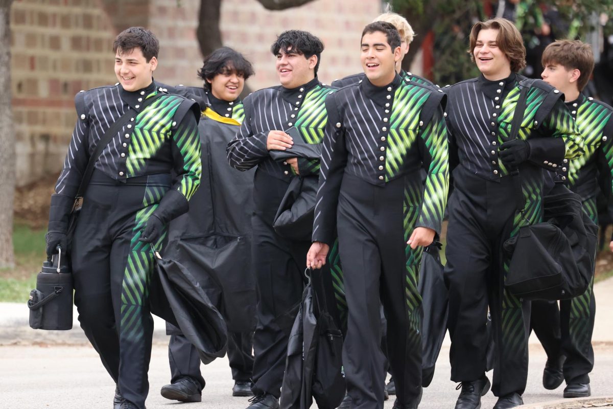 Reagan tubas walk to the buses to get to the parade.
