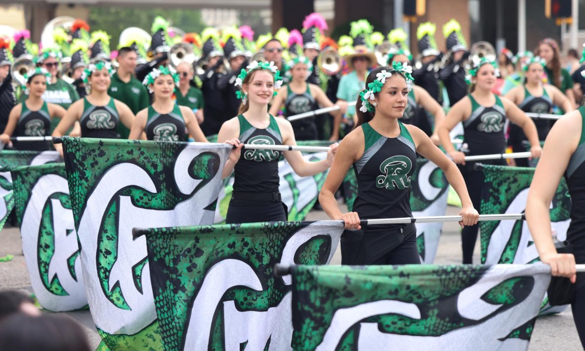 The Reagan Color Guard swings their flags for the audience.