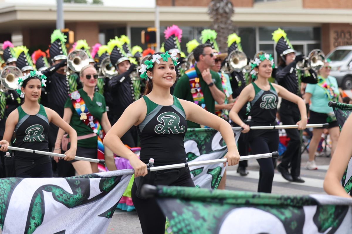 The Reagan Color Guard swings their flags for the audience.