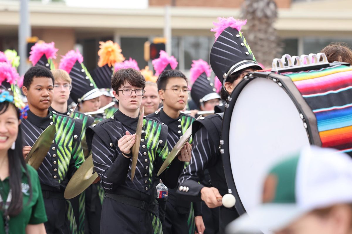 Reagan Front Ensemble crashes cymbals with the drumline.