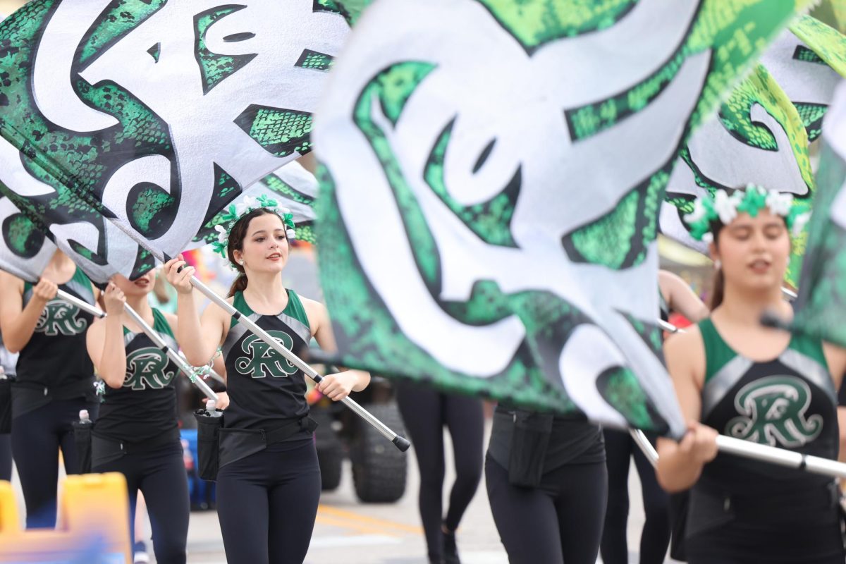 The Reagan Color Guard swings their flags for the audience.