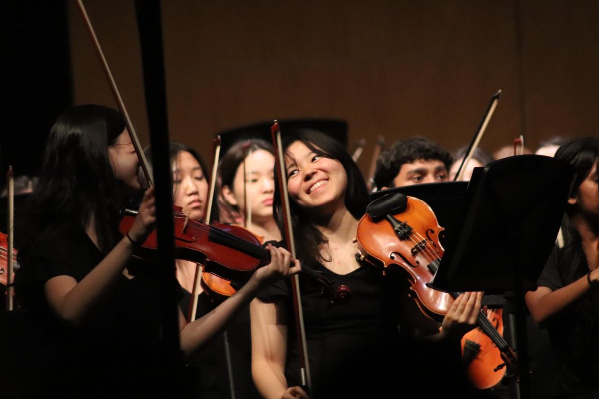 Orchestra students perform during "A Night from Broadway" concert Monday in the auditorium. The event featured songs from popular shows like "Wicked," "Hamilton," "West Side Story," and "Jersey Boys."