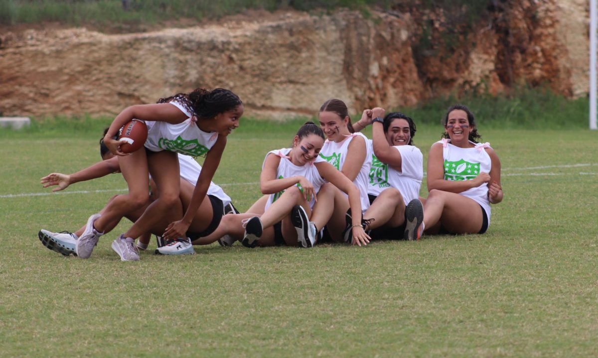 Senior girls celebrate after scoring the first touchdown of the game.