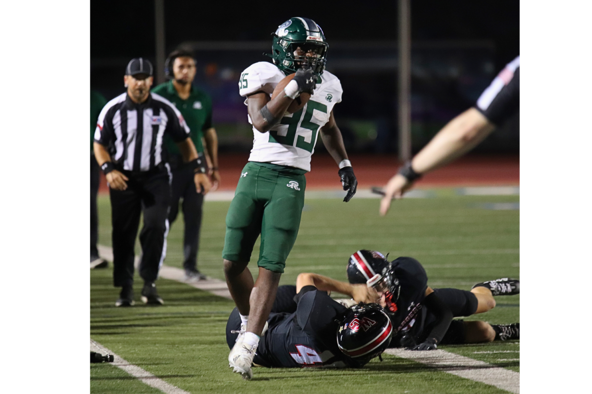 Varsity football Defensive Liner Colt Galan successfully accomplishes a significant touchdown.