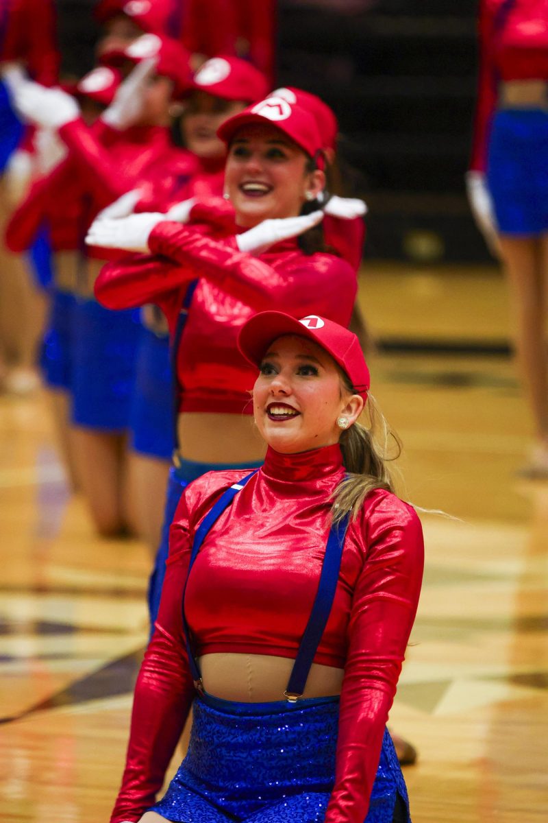 A member of the Silver Stars performs a routine during North East ISD’s “One Singular Sensation” on Saturday, Jan. 31, at Littleton Gym.