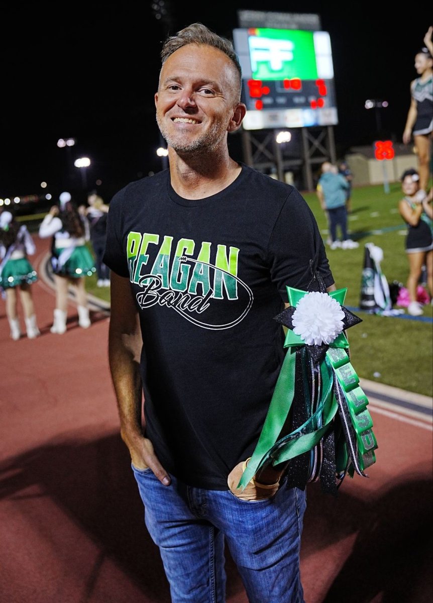 Brett Nelson showing off his homecoming mum at the football game.